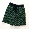 Traje de baño para niño, negro con estampado verde.